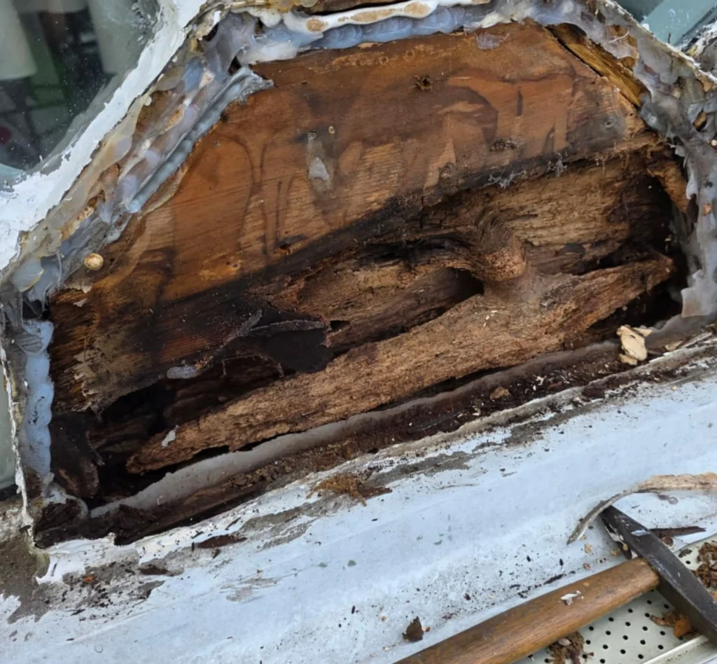 Before Custom Wood Window Repair in North Haven, NY